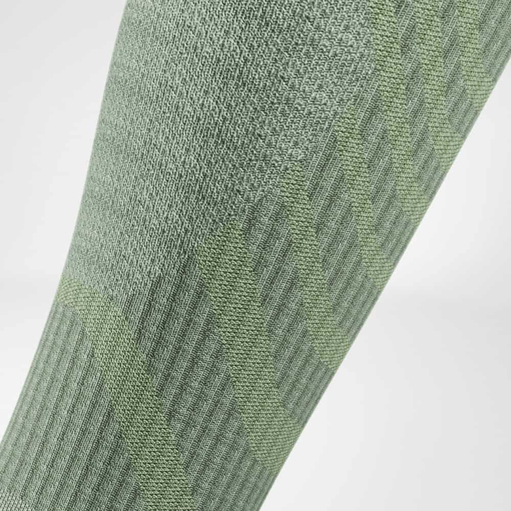 Detailed view of the calf area of ​​the merino hiking socks in light green