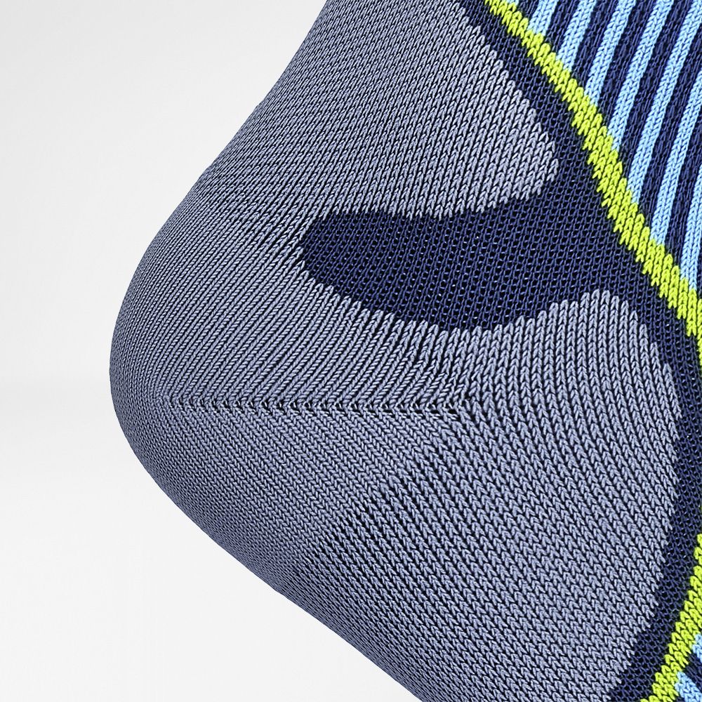 Detailed view of the heel protection zone of the blue compression stockings and running