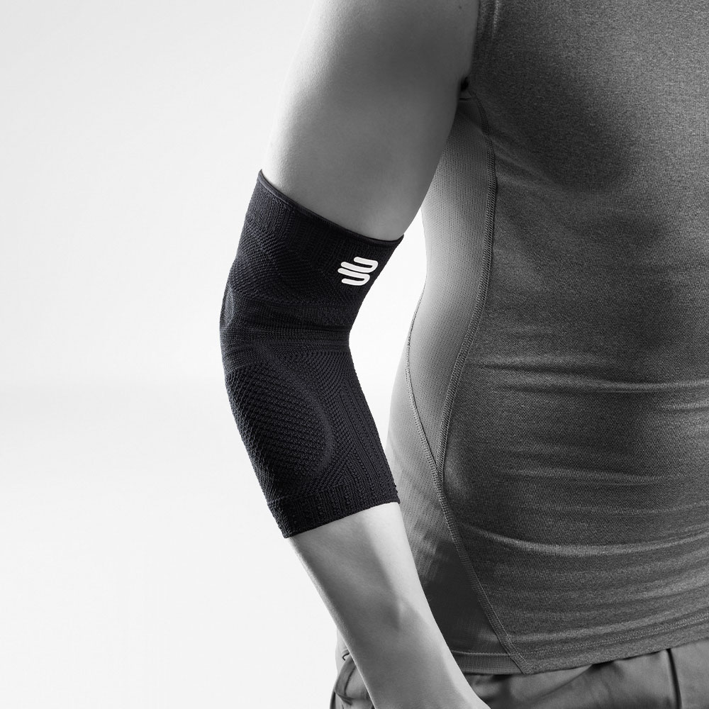 Completion of the completely black sports bandage for the elbow on the stylized gray body