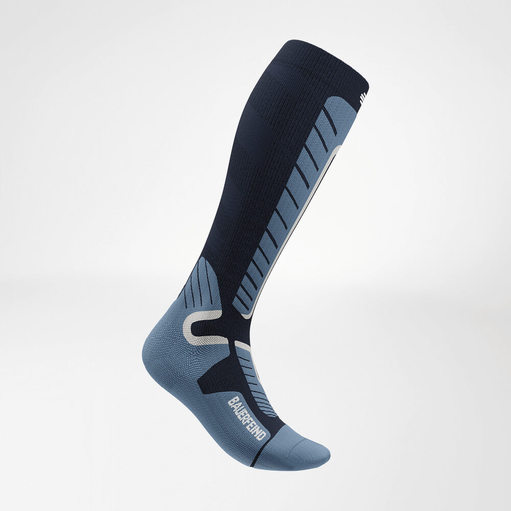 Side view of a blue knee-high ski compression sock with reinforced knit pattern for maximum support and comfort while skiing.