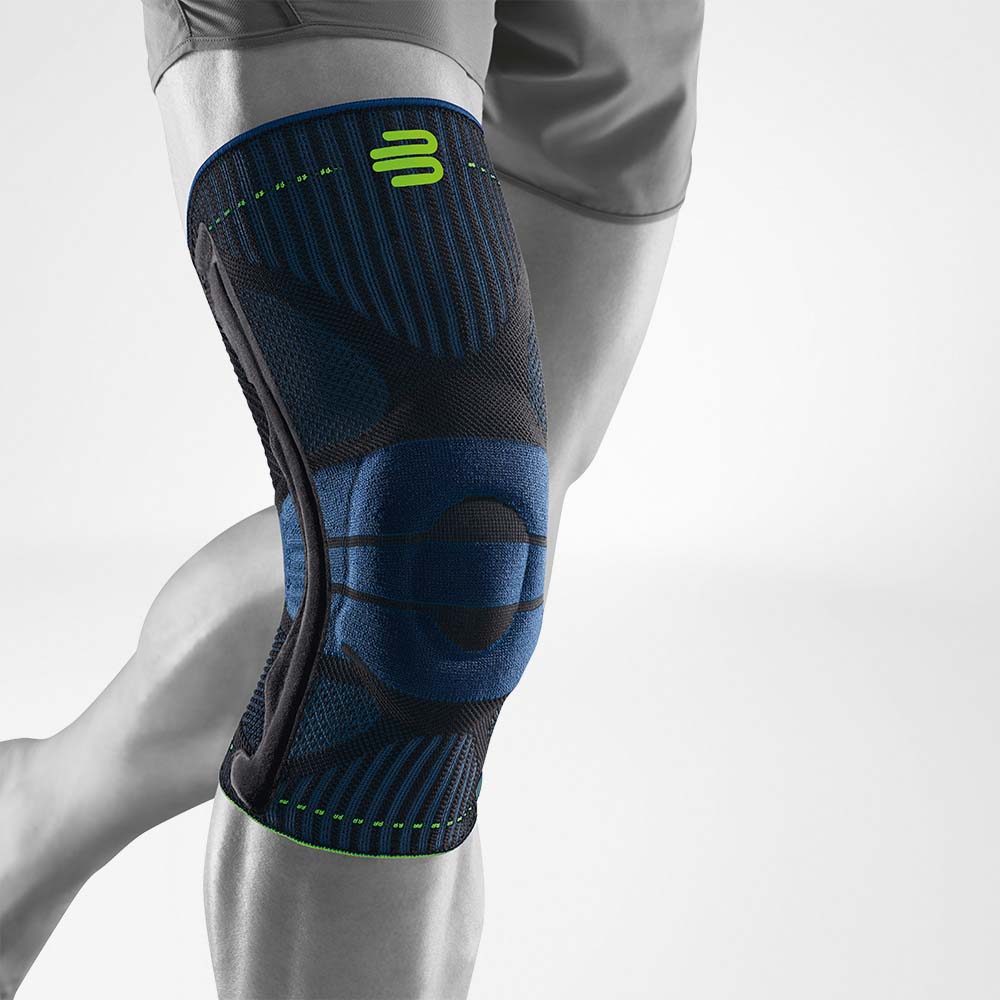 Complete view of a blue and black knee band for sport on the stylized gray leg