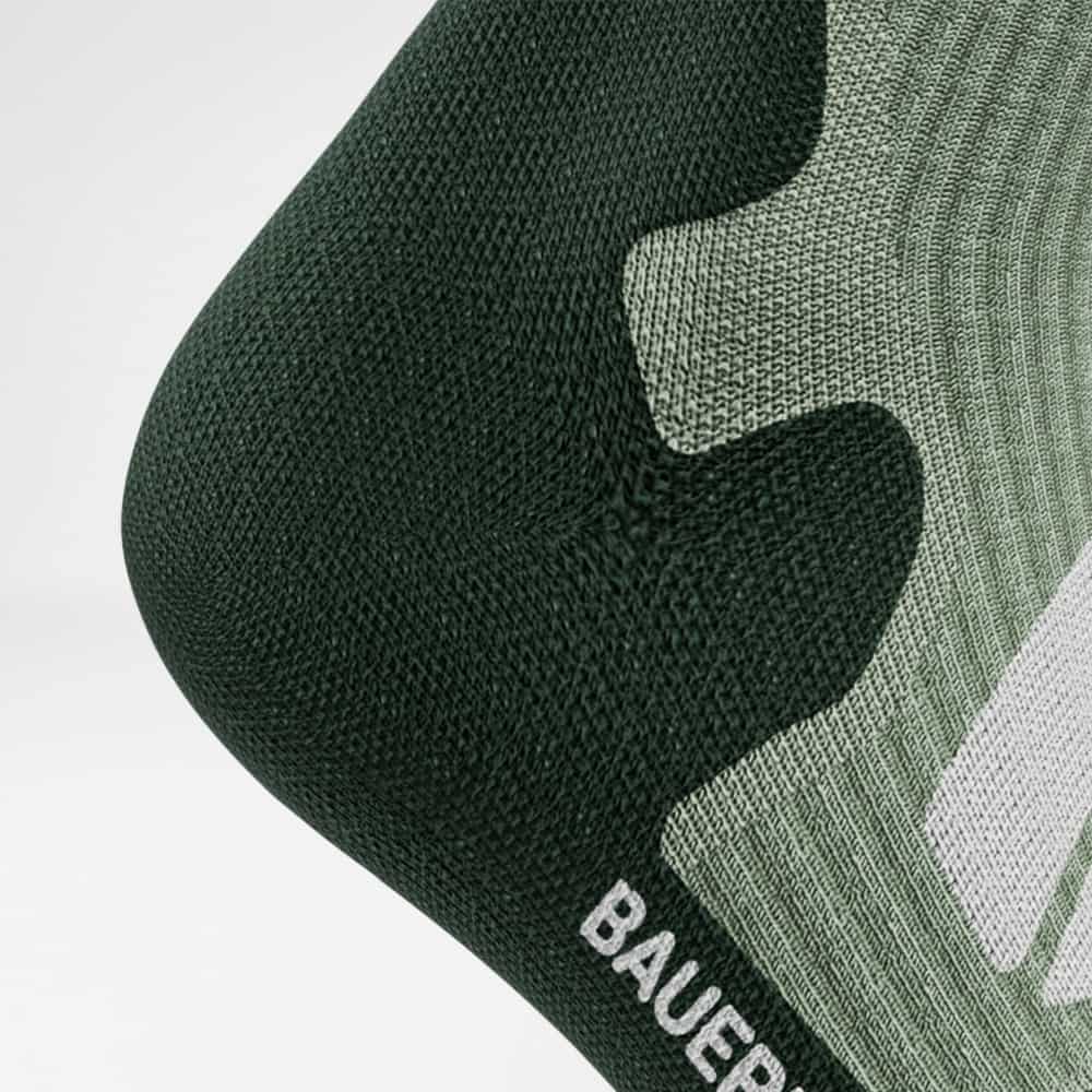 Detailed view of the heel of the merino hiking socks in light green