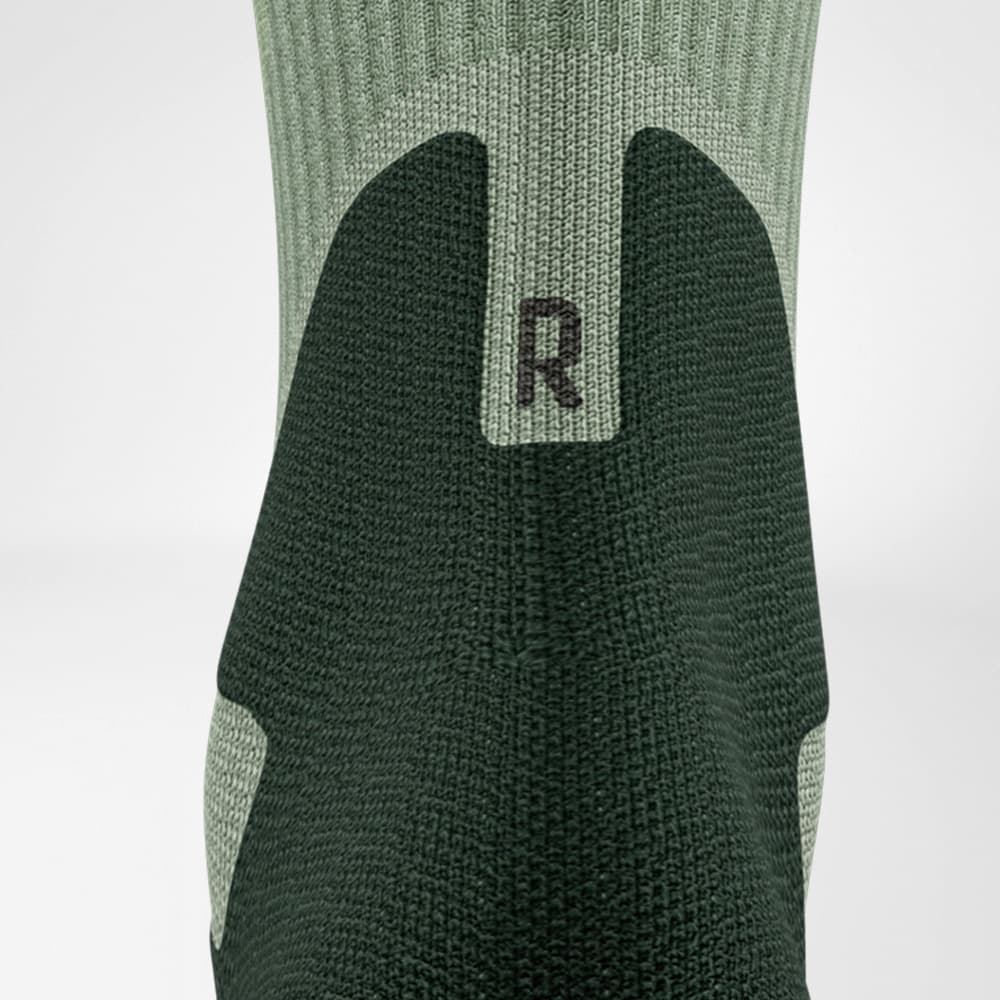 Detailed view of the Achilles marriage area of ​​the merino hiking socks in light green